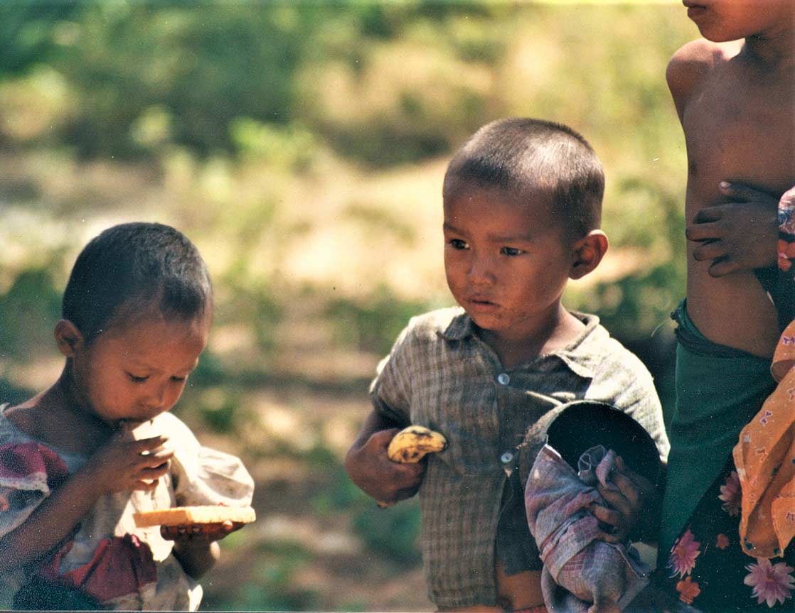 curly nomad asia myanmar burma children eating photo