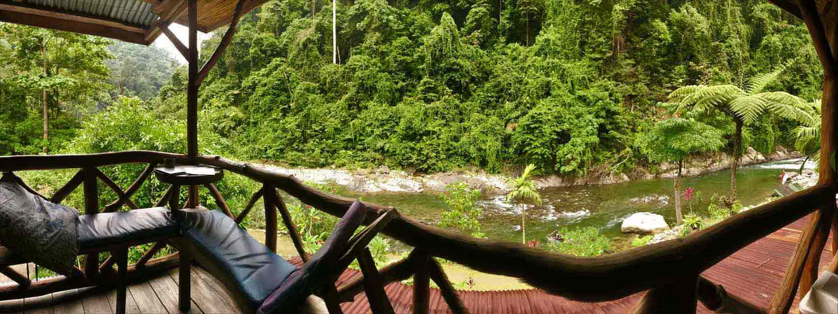 curly nomad asia indonesia sumatra lodge balcony jungle river photo